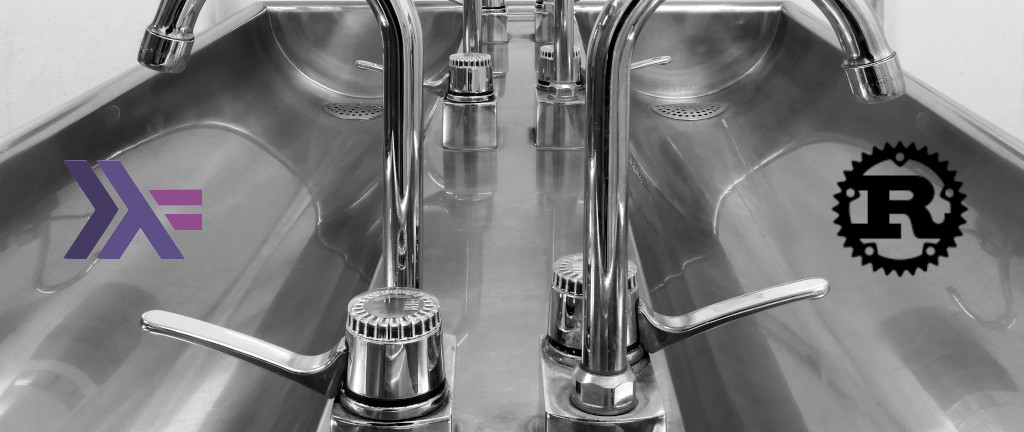 Stainless steel taps and sink with Haskell logo and Rust logo